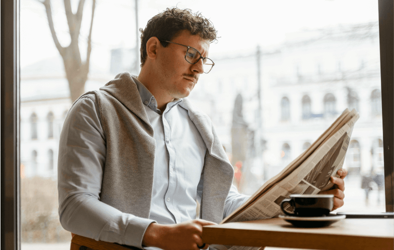 man reading newspaper